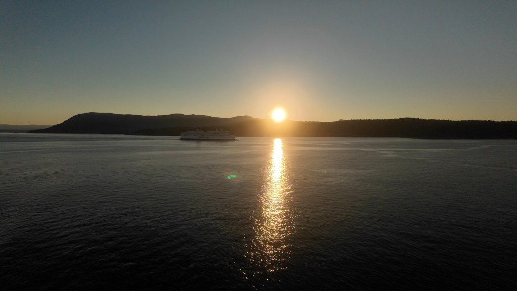 BC ferry at sunset approaching Pender Island